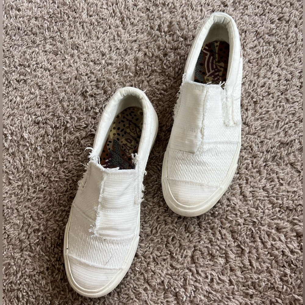 Women’s white patchwork Blowfish sneakers.